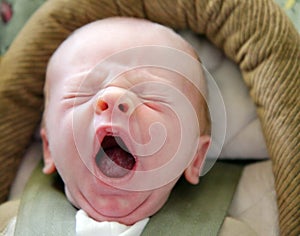 Tiny Infant with Big Yawn