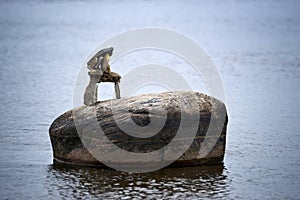 Tiny Inuksuk Atop Boulder in River