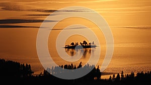 Tiny Island at sunset at Galtis mountain near Arjeplog in Swedish Lapland.