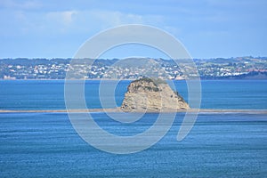 Tiny islet on top of rocky reef