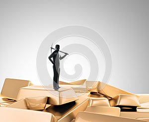Tiny man with a pickaxe on top of a pile of gold