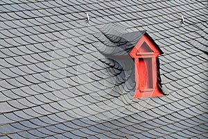 Tiny Medieval Red Dormer Window on Grey Slate Roof