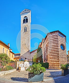 The tiny Piazzetta Dell`Immacolata and stone San Francesco Church, Brescia, Italy
