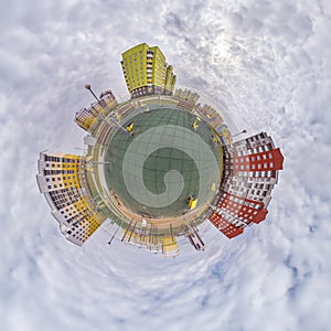 tiny planet in blue sky with clouds in city center near modern skyscrapers. Transformation of spherical 360 panorama in abstract