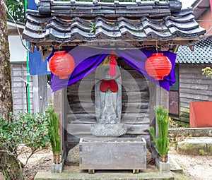 Shinto shrine with statue of Ojizou san, Wajima, Japan photo