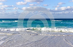 Tiny waves on the beach of the Caribbeans