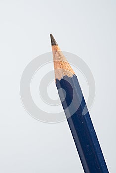 tip detail of black pencils on a little blue background. photo