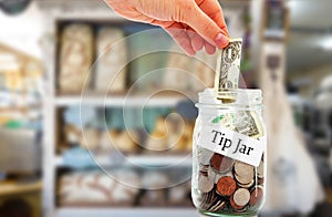 Tip jar money in a restaurant photo