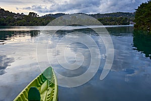 Tip of a kayak at sunset moored to a pontoon on the edge of Lac d`Esparron Provence France