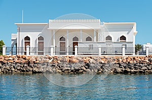 Tipica arabian white house on the coast of bay in Sur city, Oman, Middle East photo