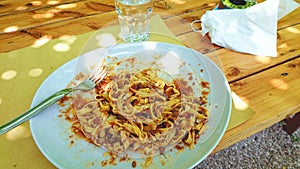 Tipica Tuscany Plate of Pasta with a glass of water photo