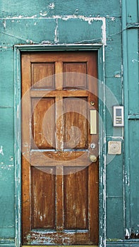 A tipical old brown wooden door in Dublin of a house photo