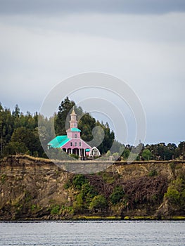 Tipical wood made church in Chiloe island, Chile. Patagonia, view crossing the channel