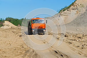 Tipper dumptruck carrying sand