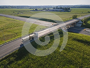 Tipper truck on street road highway transportation aerial view