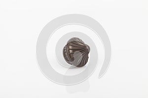 Tips of brown plastic for curtain poles on white background