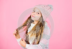 Tips for caring for knitted garments. Child long hair warm soft woolen hat enjoy softness. Kid girl wear knitted soft