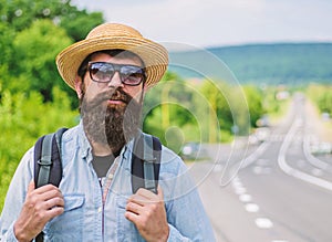 Tips of experienced traveler. Man bearded hipster backpacker at edge of highway. Take me with you. Traveler waiting for