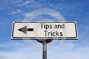 Tips and tricks road sign, arrow on blue sky background