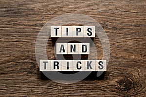 Tips and tricks - word concept on building blocks, text