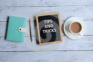 Tips and tricks written on a blackboard.