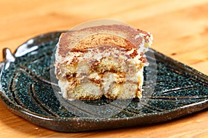 Tiramisu cake on decorated plate