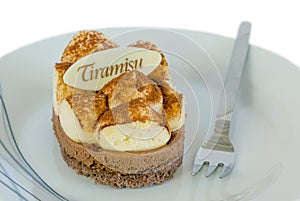 Tiramisu cake with label isolated.