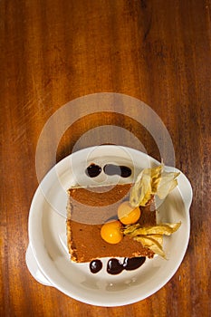 Tiramisu cake piece brown with goose berry