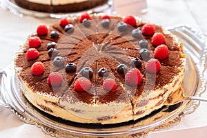 Tiramisu cake with raspberries Traditional Italian dessert