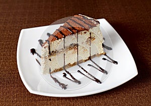 Tiramisu cake on a white plate