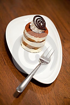 Tiramisu cake on wood table background