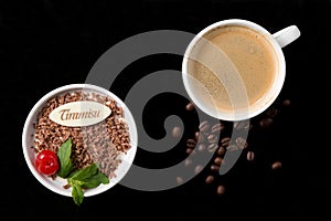 Tiramisu dessert, cup of coffee and beans
