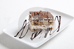 Tiramisu dessert on white plate