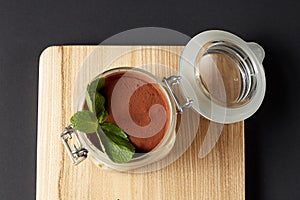 Tiramisu with mint in a glass jar