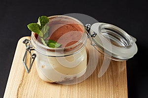 Tiramisu with mint in a glass jar