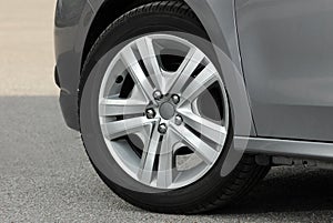 Tire and alloy wheel on this small passenger car