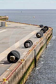 Tire Bumpers Along Concrete Pier