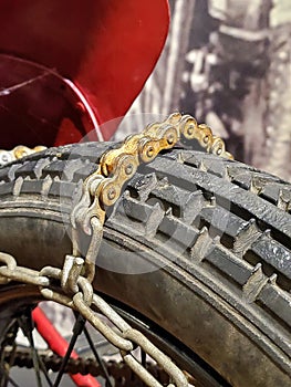 Tire chain on motorcycle wheel