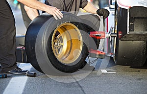 Tire change during pitstop photo