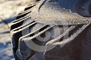 The tire is covered with frost.