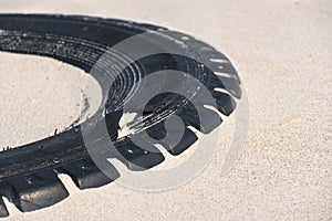 Tire left on a beach, environment pollution concept