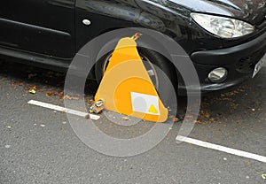 Tire lockout for illegal parking violation on the streets of London, UK.