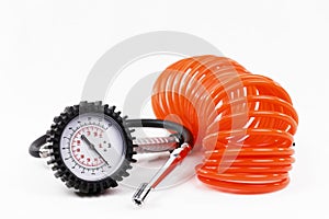 A tire manometer with spiral pressure hose and valve