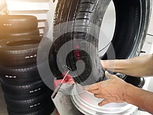 Tire patch, Car service, Tyre repair. Mechanic repair of tire.