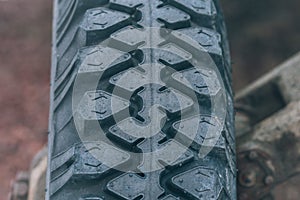 Tire pattern. Vintage car wheel close-up. Off-road tires for truck.