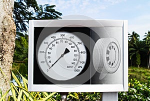 Tire Pressure Gauge, manometer closeup at gas station