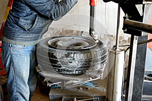 A tire repairer repairs car tires, tire change