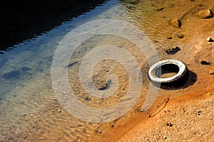 A tire in the river