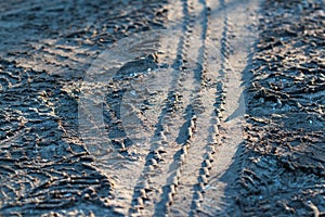 Tire`s tracks printed on the road photo