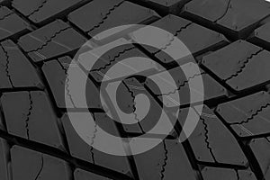 Tire texture.Tire texture.Textured  black surface of new car tyre with geometric tread closeup